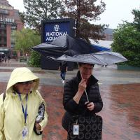 Kathryn and Peggy with damaged umbrella trying to stay dry in Baltimore Harbor