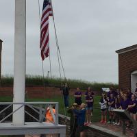 Bill raising the flag at Fort McHenry