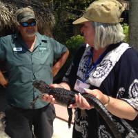 Sue holding Baby Alligator and Pilot Mike