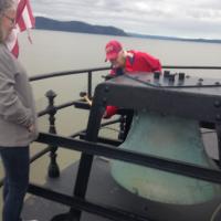 Linda waiting her turn as Sandy bangs the fog bell signal at the Tarrytown Lighthouse