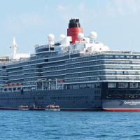 Queen Elizabeth was moored near Guernsey.  Note it is registered in Hamilton (Bermuda).  This allows them to host weddings on board.