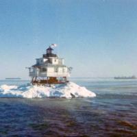 Thomas Point Shoal Lighthouse “encased” in ice. Notice the merchant ships in the background. 