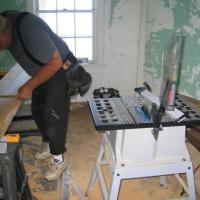 Al Pearson cutting wood for doorjamb and threshold replacement
