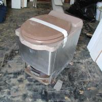 The old U.S.C.G. “Incinolet” toilet removed and ready for disposal