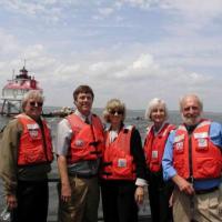 In front of Thomas Point Shoal lighthouse: (l-r) Buck Buchanan, Annapolis Maritime Museum; Mr. John Hughes, husband of Secretary Norton; Secretary Norton; RADM Brice-O’Hara; Mr. Wheeler.